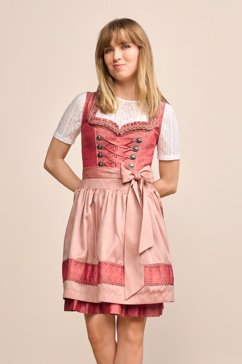 Kruger Mini Dirndl 2pcs 50cm Caprina in pink with sweetheart neckline and decorative apron.