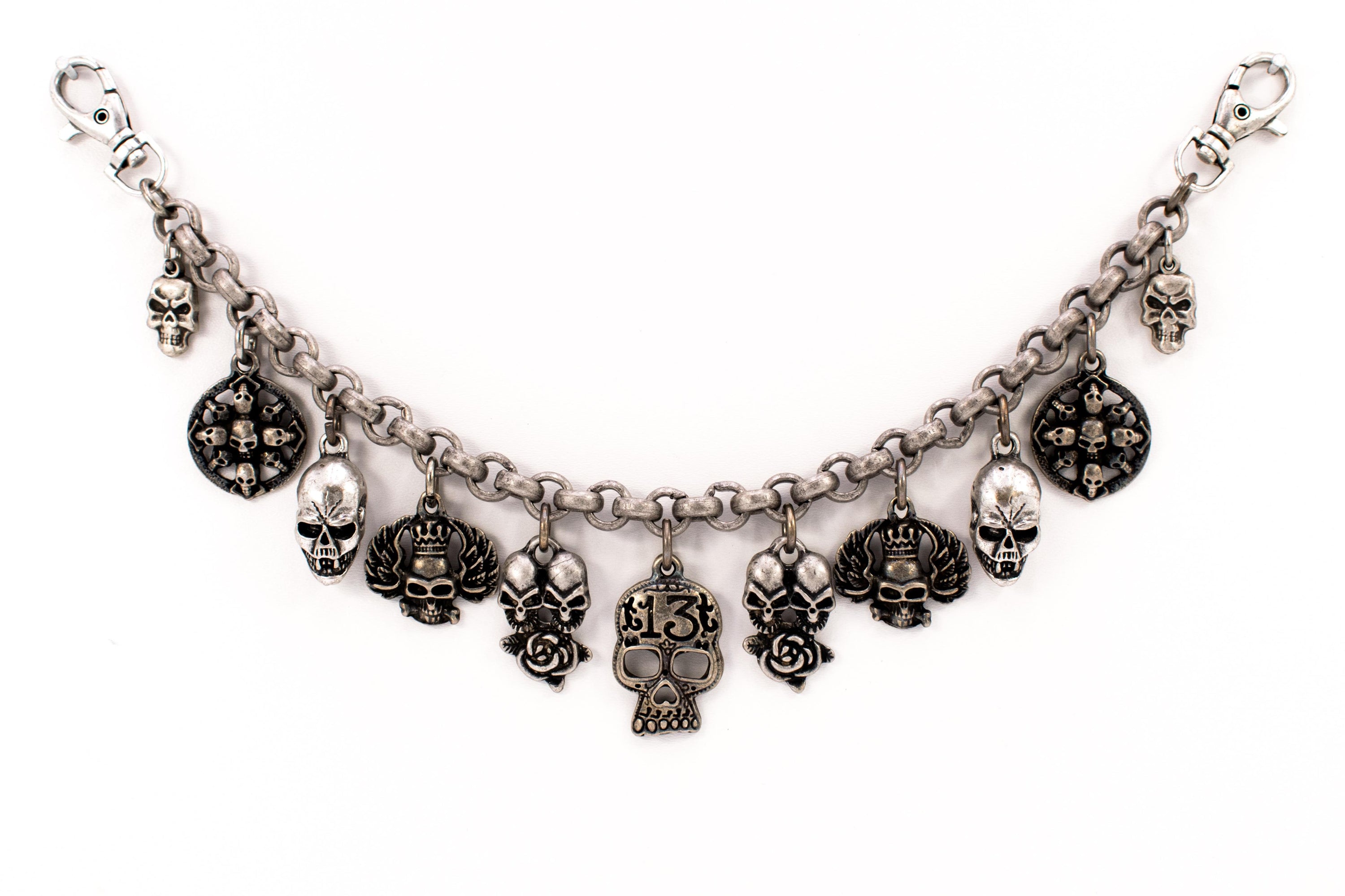 Charivari with various "skulls" in antique silver