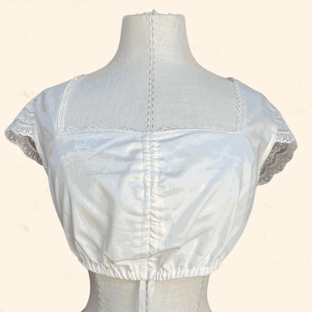 Ecru dirndl blouse from Kruger Collection, size 34, 100% polyester.